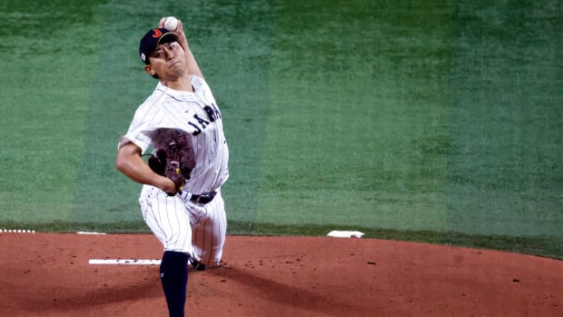 Mar 21, 2023; Miami, Florida, USA; Japan starting pitcher Shota Imanaga (21) pitches against the USA in the first inning at LoanDepot Park. Mandatory Credit: Rhona Wise-USA TODAY Sports